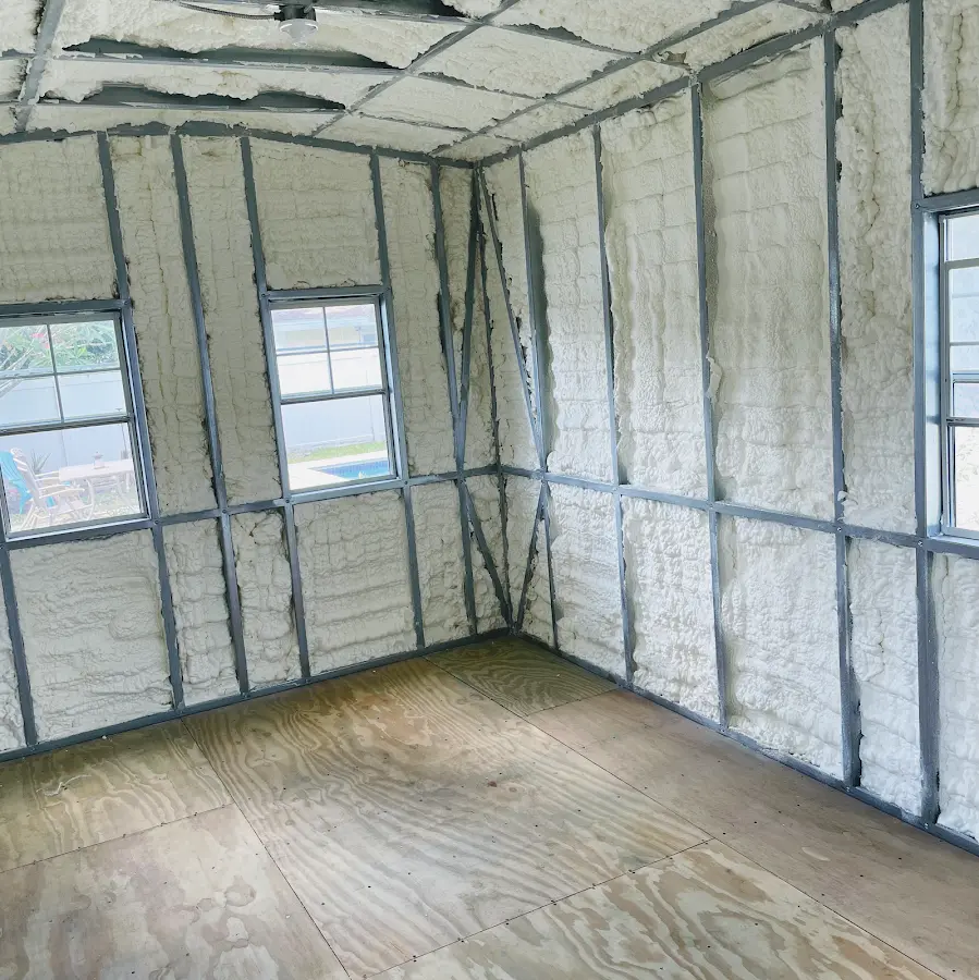 Closed-cell spray foam insulation applied to wall cavities in a residential project in Romulus